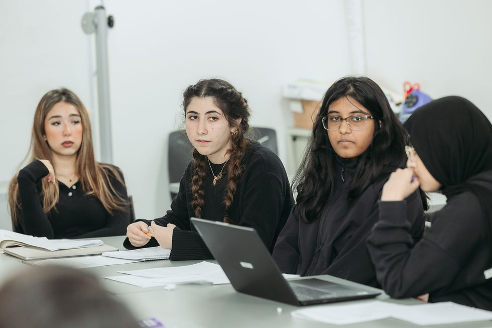 High school students with a computer during a class