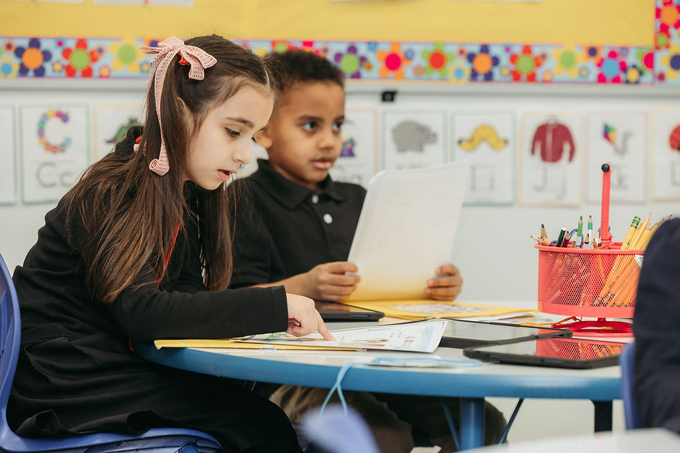Young students on colorful classroom