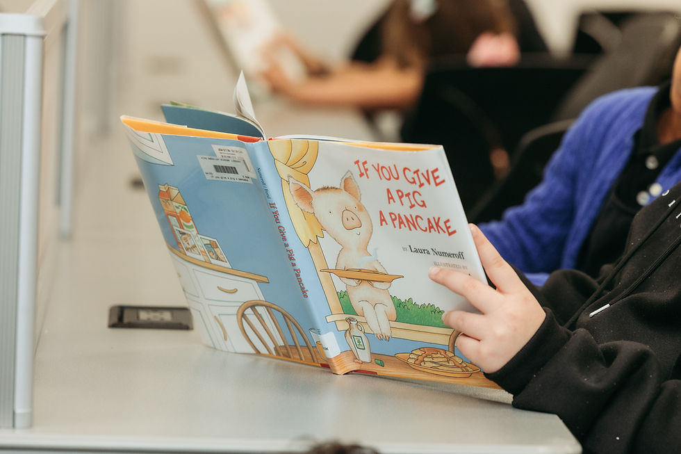 Students reading at school library