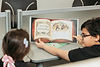 Older kid reading for younger kid