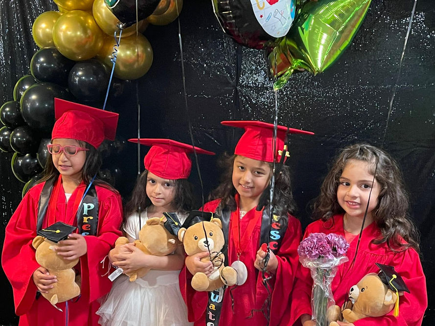 Kids at graduation ceremony at Fifi's Creative Kids Center