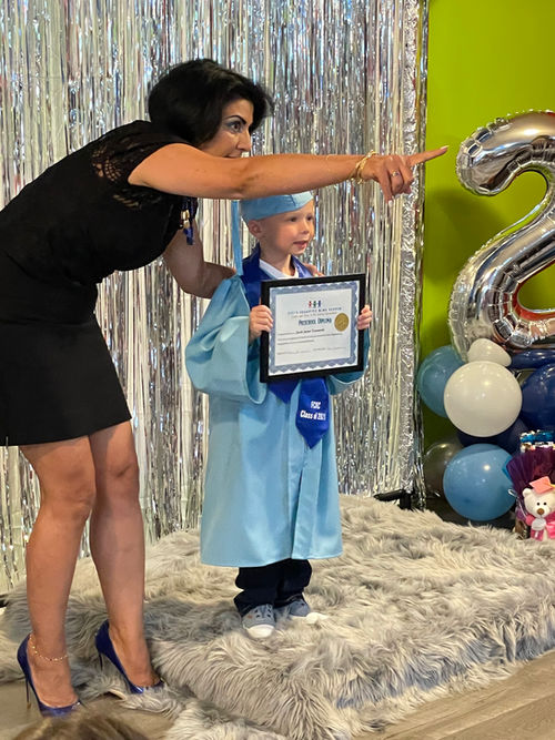 Kids at graduation ceremony at Fifi's Creative Kids Center