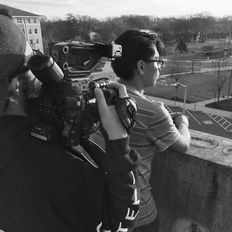 Cameraperson filming on a rooftop