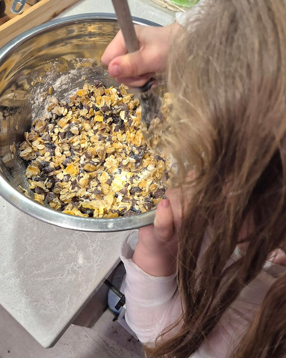 Our daughter having fun whipping up a batch!