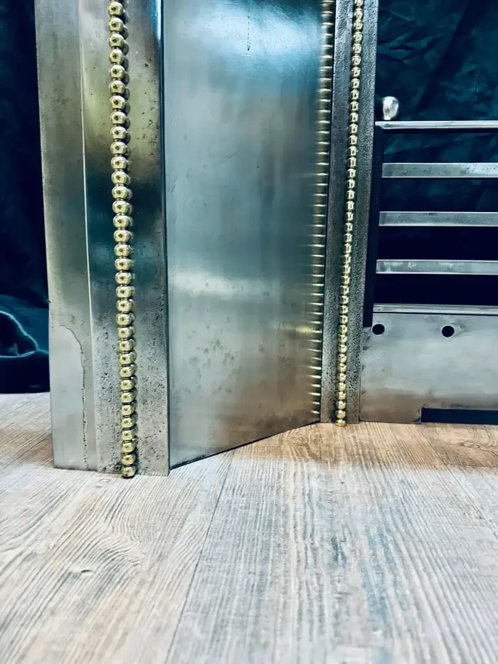 Thumbnail: A Late 19th Century French Splayed Steel and Brass Fireplace Insert.