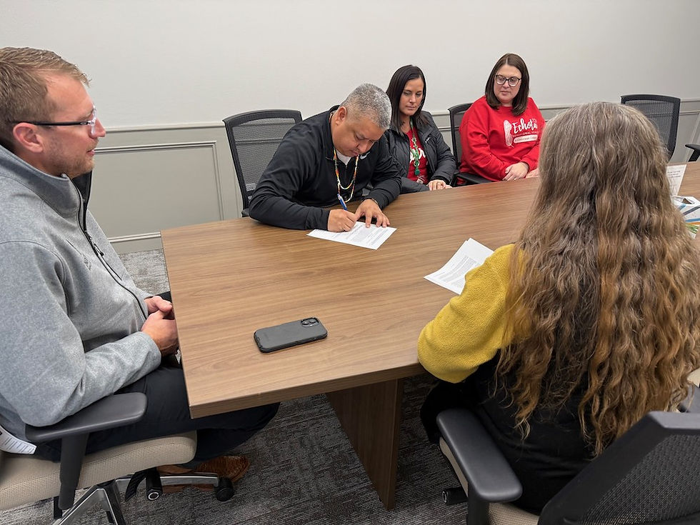 United Keetoowah Band Chief Jeff Wacoche signs documents finalizing the Tribe’s acquisition of a healthcare administration building in Tahlequah on Dec. 16, 2025.