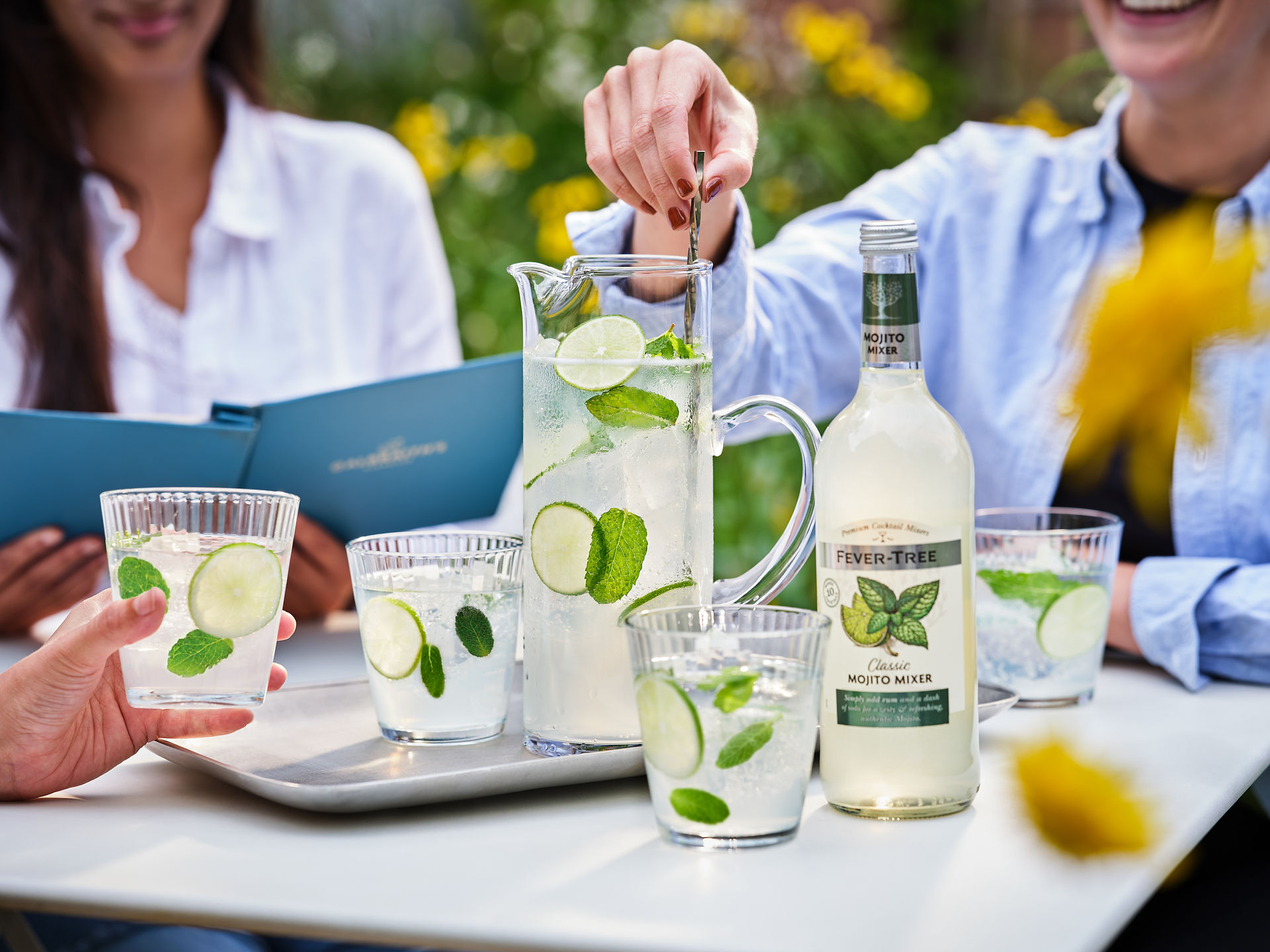 Fever Tree Drink Mixer outside table setting with two friends