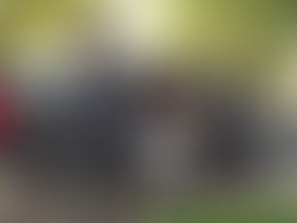 Professional chauffeur greeting passengers heading to a graduation or spring celebration, representing comfort, elegance, and smart planning.