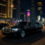 black luxury limo driving at night city lights_edited.jpg