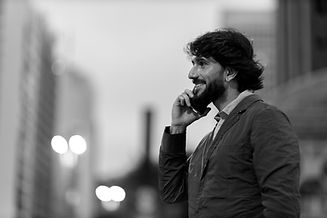 view-young-man-using-smartphone-night-time-with-city-view-landscape-background-mobile-phon