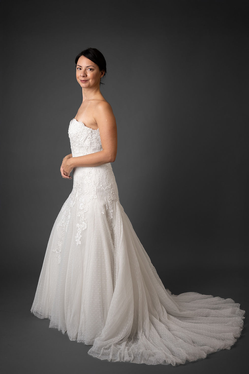 Thumbnail: Lace Pronovias wedding gown photographed at Enso Brautkleider side view