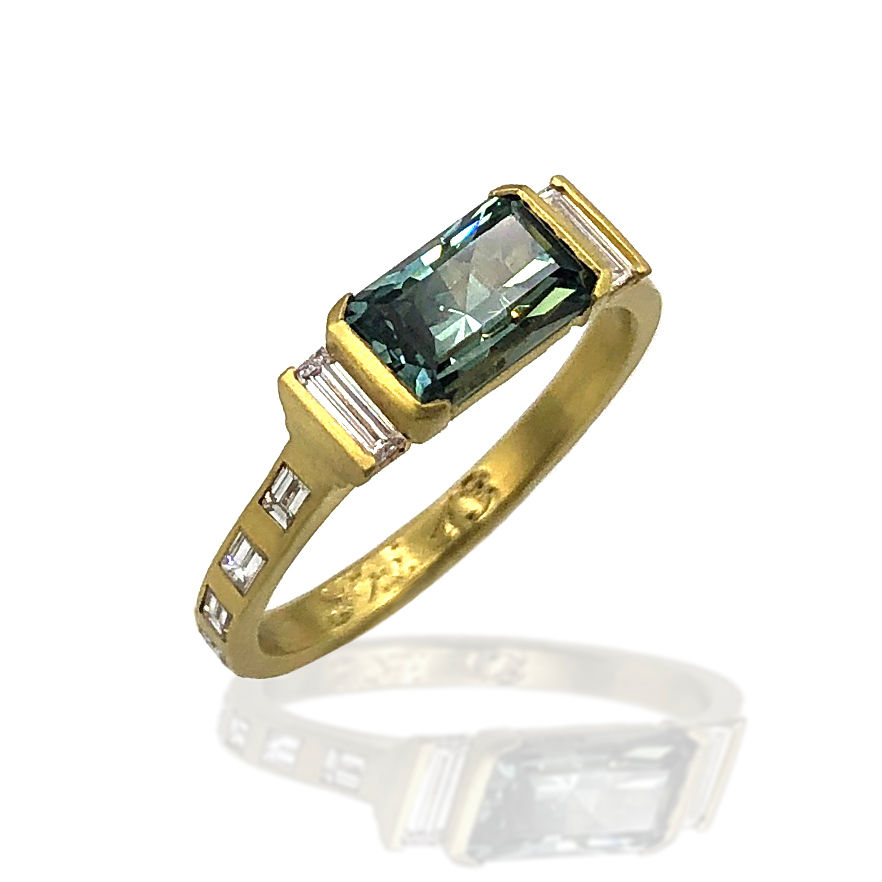 Thumbnail: Teal East-West Montana Sapphire Engagement Ring with Baguette Diamond Band in 18kyg