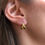 Thumbnail: Gold Woven Huggie Earring Stud Earrings in 18k Reycled Yellow Gold