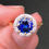 Thumbnail: Bespoke Round Sapphire Engagement Ring with Diamond Halo in 18k Yellow Gold and Platinum