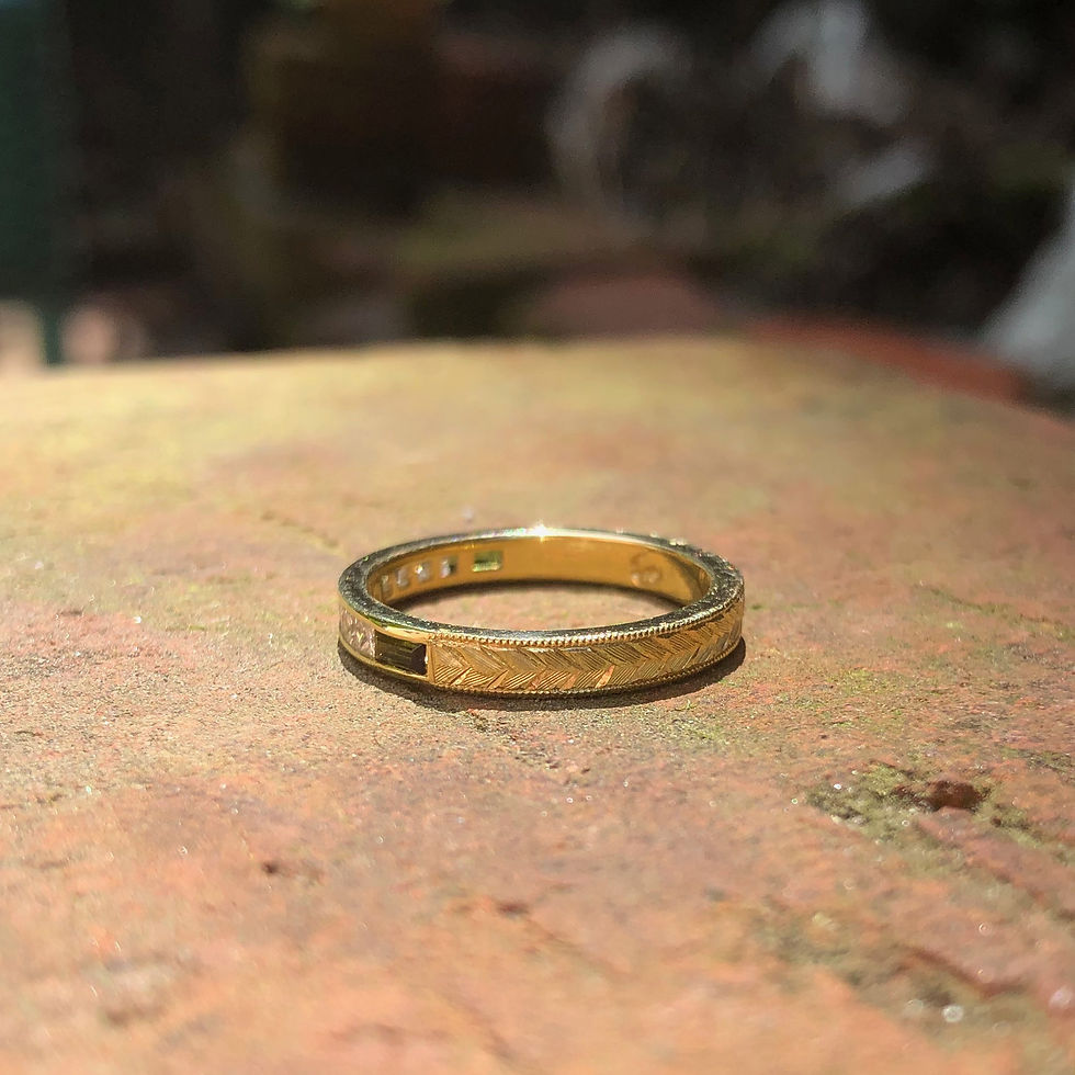 Thumbnail: Bespoke Princess Cut Diamond and Green Tourmaline Baguette Channel Set Ring with Modern Wheat Pattern Engraving in 18k