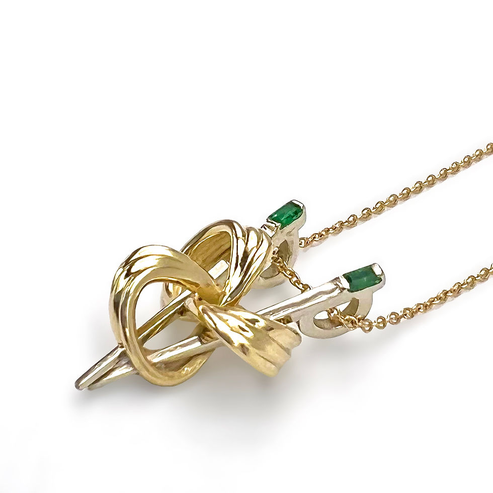 Thumbnail: Custom Dim Sum Knot Necklace in 14k with Emerald Baguettes