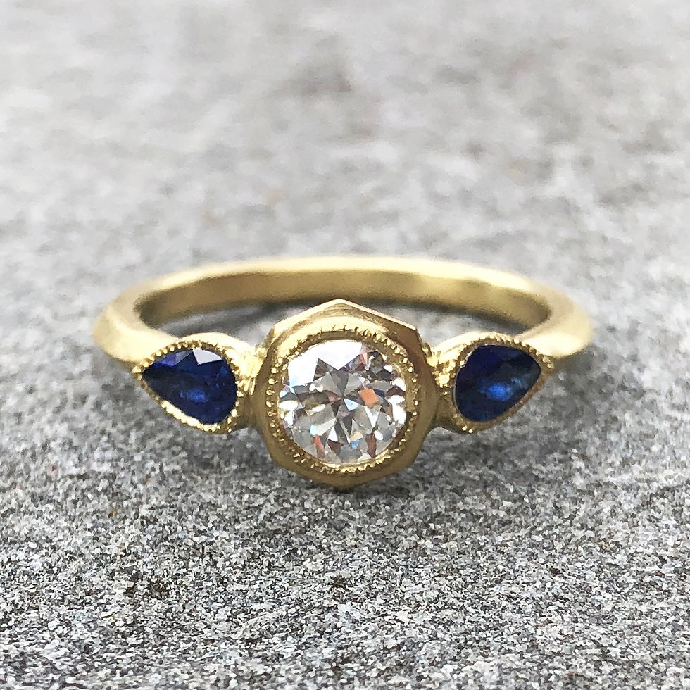 Thumbnail: Bespoke Pear-Shaped Sapphire and Old European Cut Diamond Ring in 18k Recycled Yellow Gold with Milgrain Detail and Knifeedge