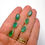 Thumbnail: 10.10ctw Zambian Emerald Triple Drop Earrings in 18k yellow gold