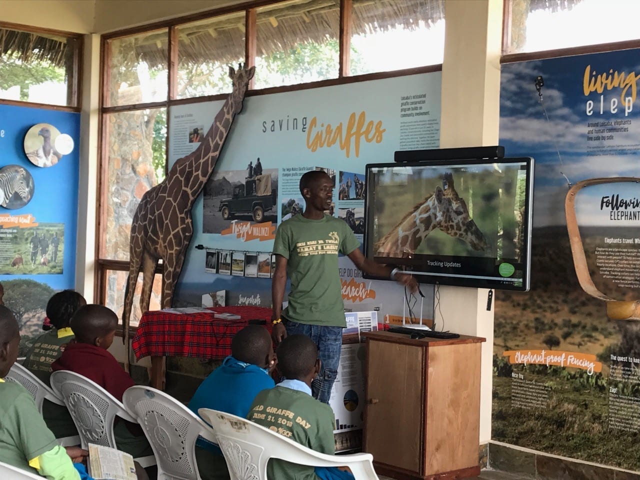 Lexson Larpei (Twiga Walinzi) teaching local school children about giraffes.
