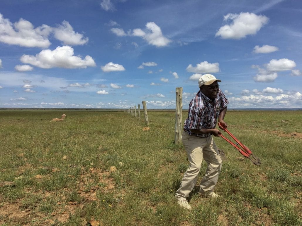 Simon Gitau opening the fence between Kitenye and Mugie