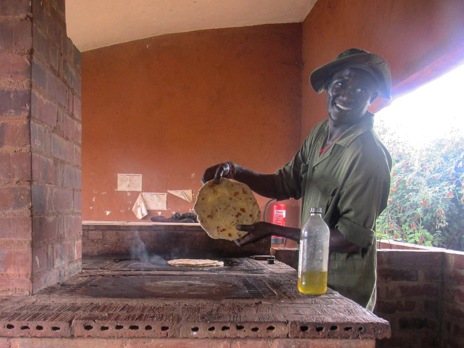 The Community Cooker in action – safely burning plastics and other waste material to generate fuel for cooking.