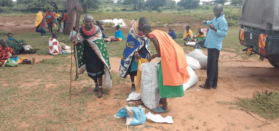 Koija community receiving food supplies.
