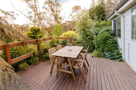 StayZen outdoor dining table on deck garden view