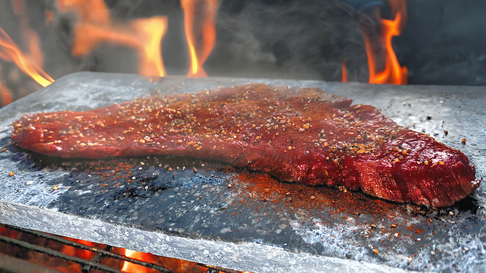 steak cooking on a soapstone grilling stone