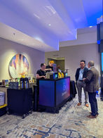 NOMADIKA barista behind custom brand-wrapped mobile espresso cart at Gartner Executive Summit Marriott Toronto