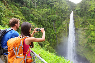 couple hiking hawaii waterfalls