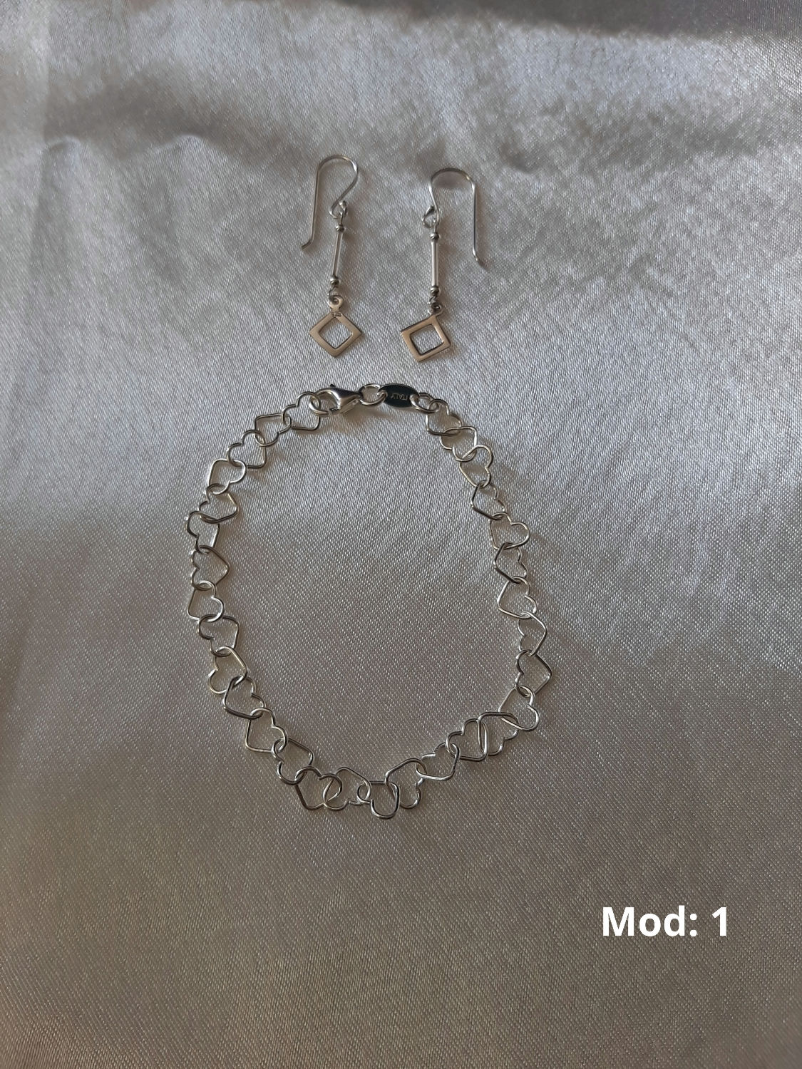 Juego de plata de pulsera y aros 