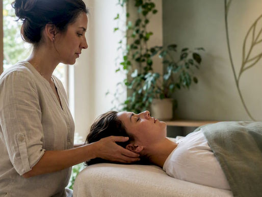 Therapist performing craniosacral therapy on patient