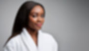 Beautiful darkskin lady with white robe on 
