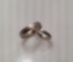 Thumbnail: Matching wedding bands yet unique.  forged from same metal to create a set mokume gane ring set