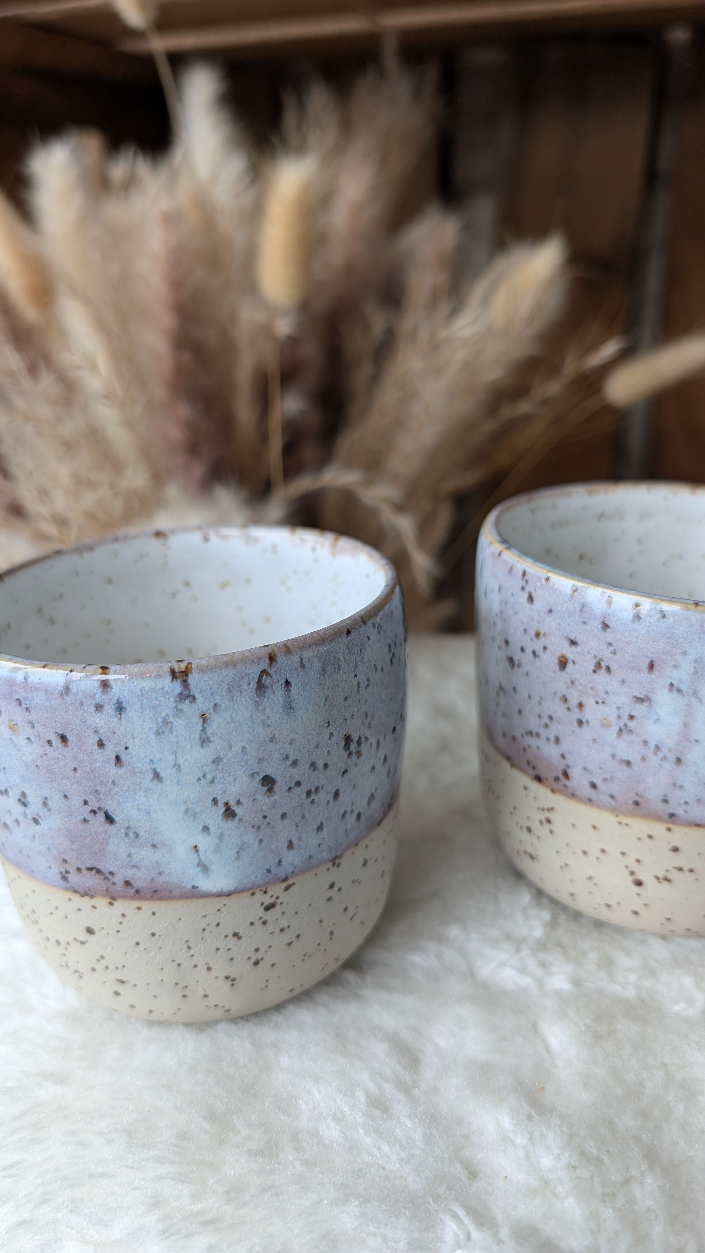 Two speckled violet glazed mugs 