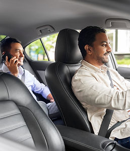 man transporting gues in a car
