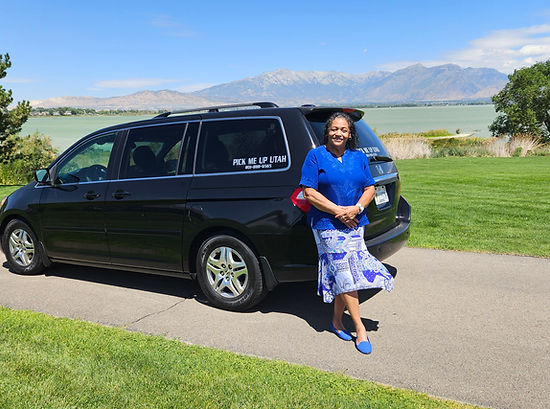 Owner standing next to one of the cars