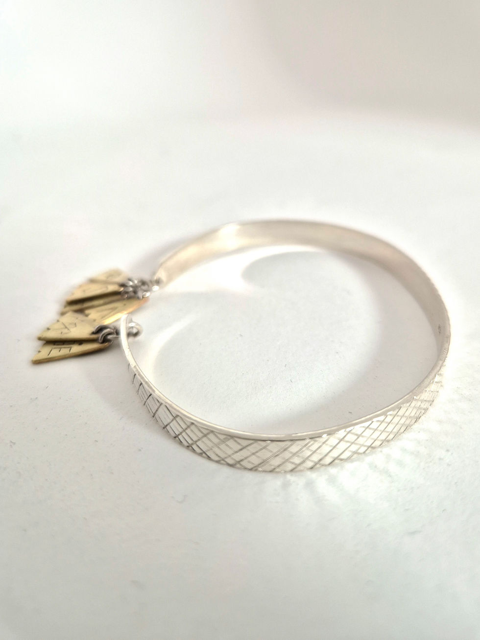 Thumbnail: Latvian SEPTIŅDIENU Sterling Silver Cuff with Hand-Carved Symbolic Detail