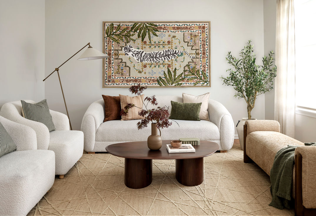 Cozy living room with statement art and modern furniture.
