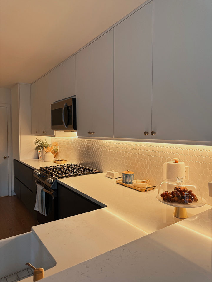 Modern kitchen with sleek design and under-cabinet lighting.