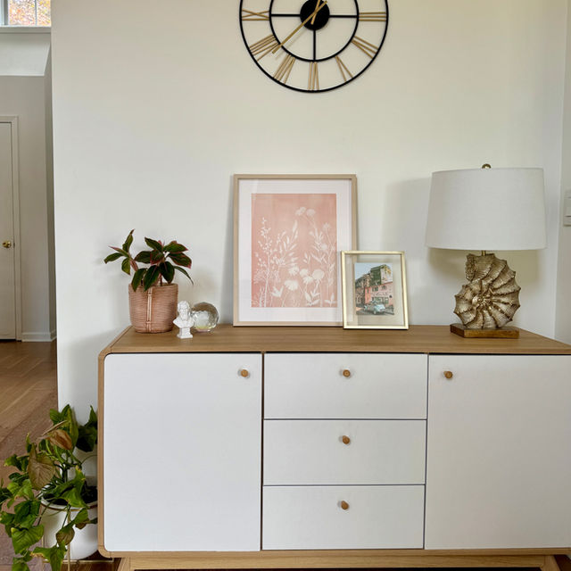 White cabinet decor and wall clock above. Interior design service West Orange, NJ