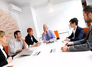 Executives analyzing LMS data reports