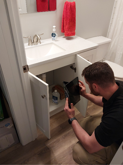 Professional drain cleaning service by Top Tier Trades for residential pipes.