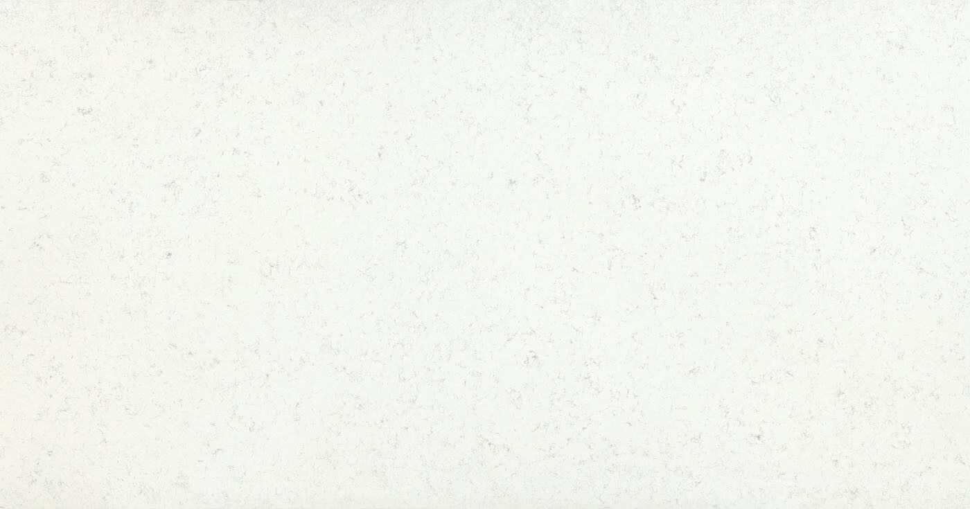 Abstract white background with a subtle spotted texture, seemingly paper-like in appearance.