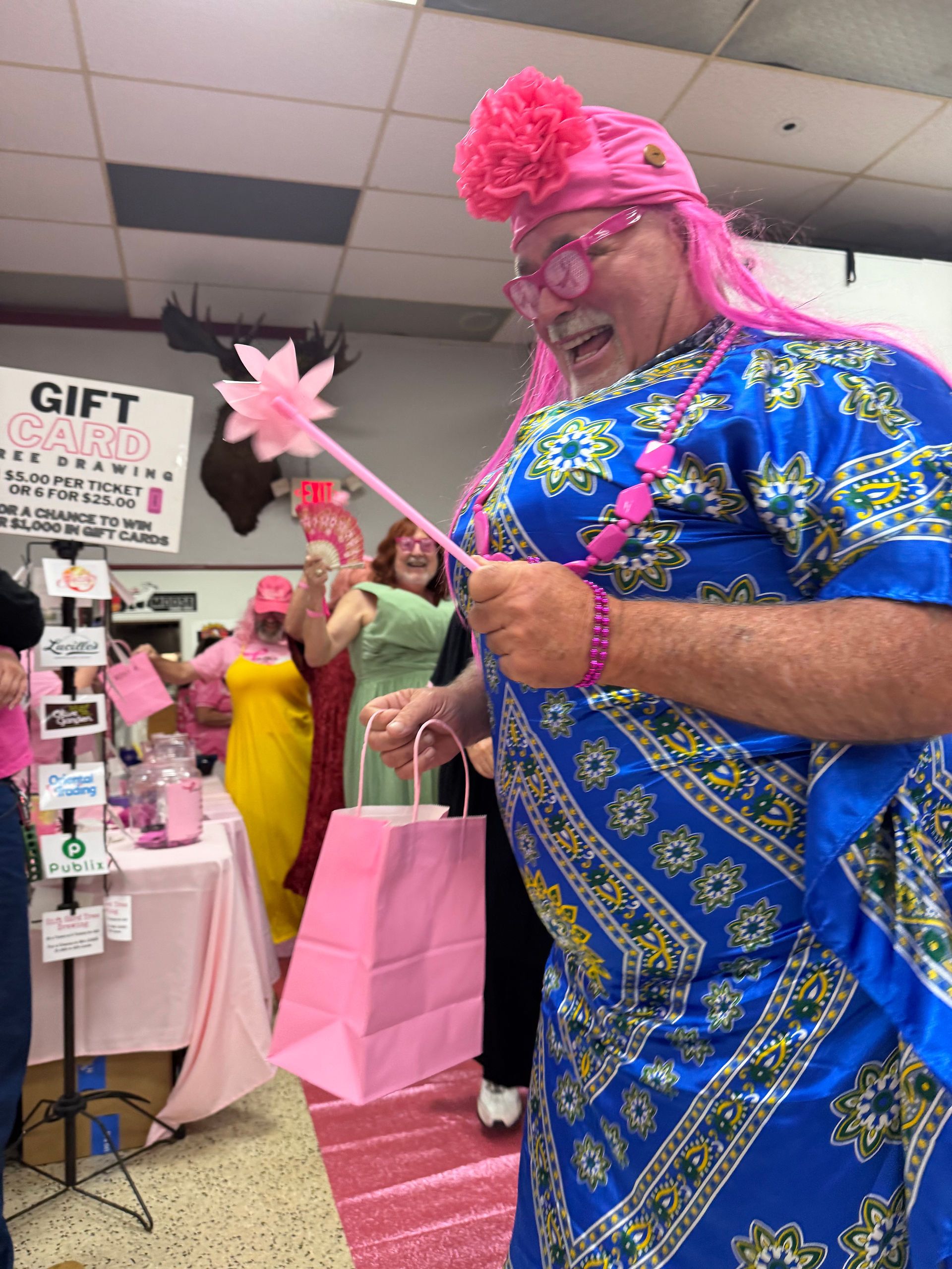 Male participants in the Brotherhood of Pinkness fashion show supporting breast cancer awareness