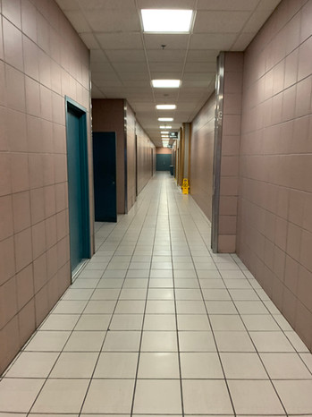 Service corridor behind food court, still clad in original pink and teal color scheme, 2019