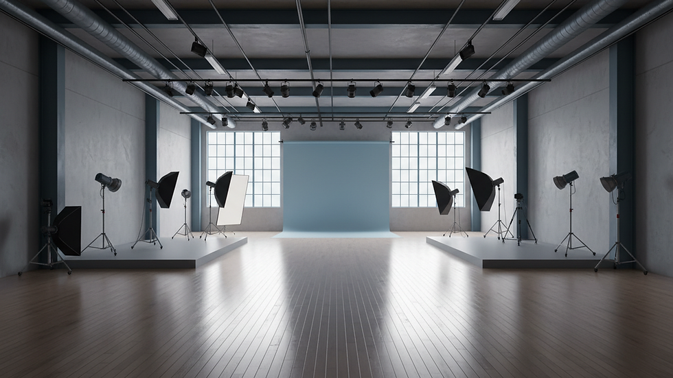 Eye-level view of a spacious, well-lit studio with wooden floors