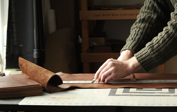 Hand cutting leather.jpg