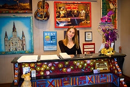 Receptionist greeting guests at the entrance of Tibby’s New Orleans Kitchen in Tampa