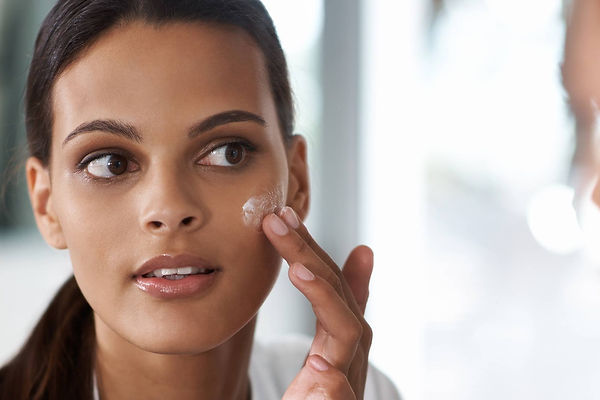 A person cleansing their face with a gentle foaming cleanser, targeting excess oil and impurities on oily skin.